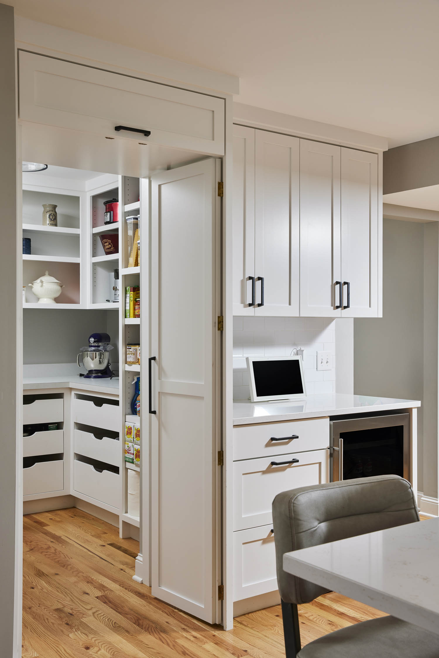 Kitchen remodel in St. Louis Park, Minnesota featuring a hidden pantry and faux inset cabinets in modern farmhouse style.