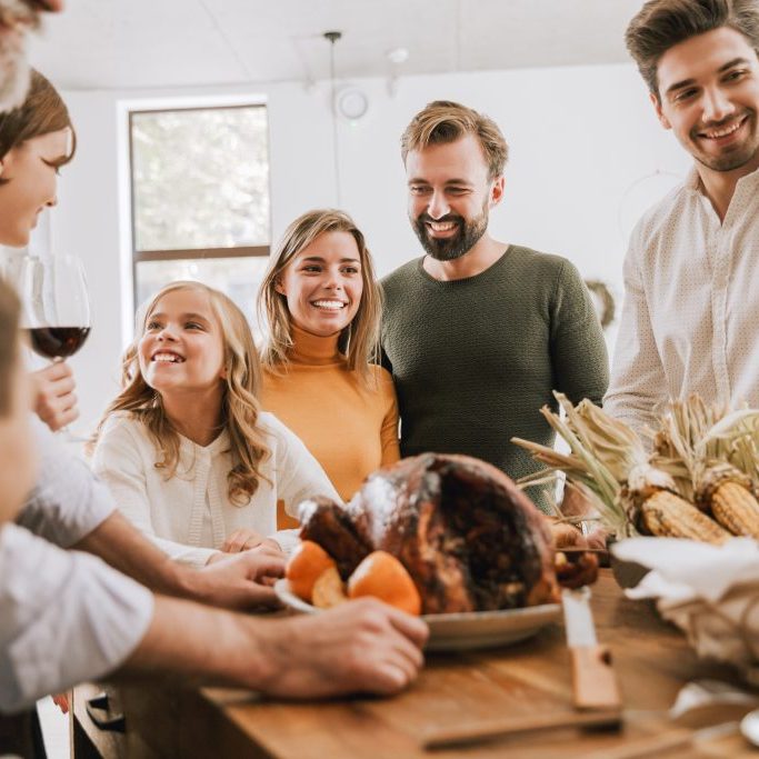 Big happy family celebrating Christmas together at home, preparing tasty dinner